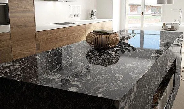 Polished granite countertop in a modern kitchen showcasing durability and natural stone patterns