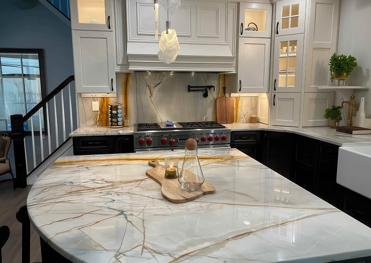 White and black kitchen with marble countertops, stainless steel range, and unique pendant lighting